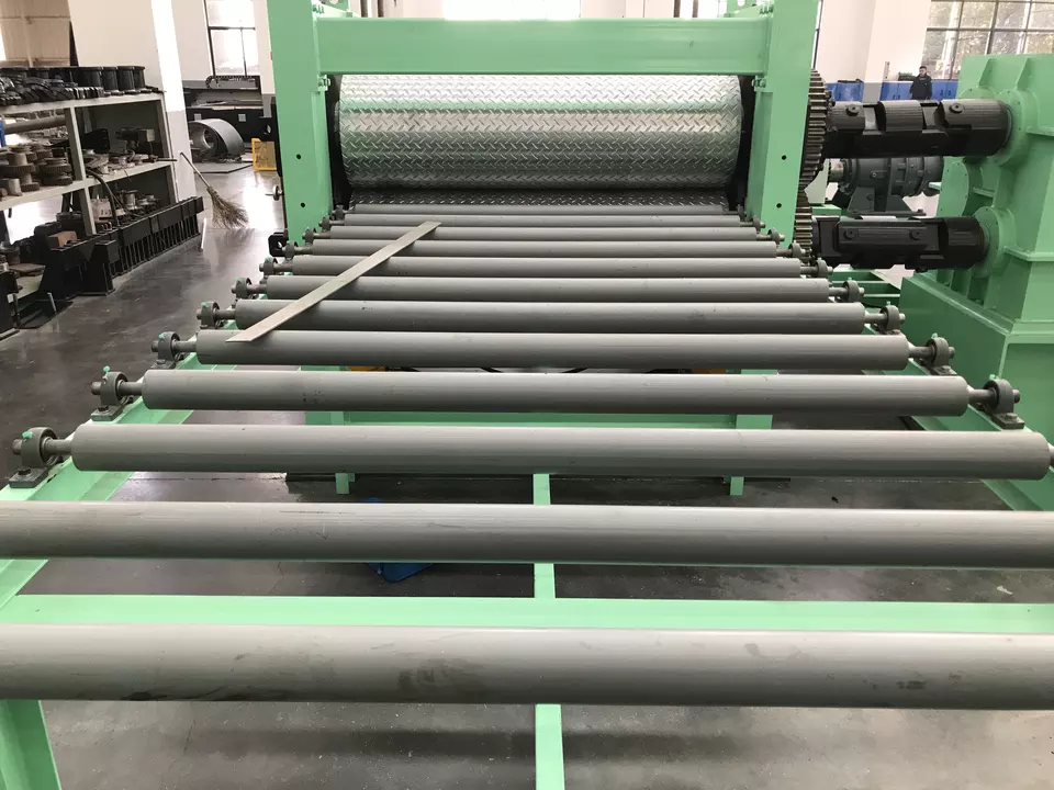 Metal plate embossing machine